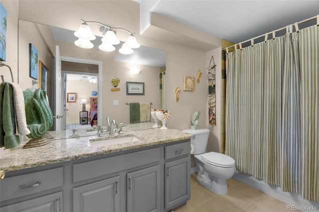bathroom featuring tile patterned floors, vanity, toilet, connected bathroom, and ceiling fan