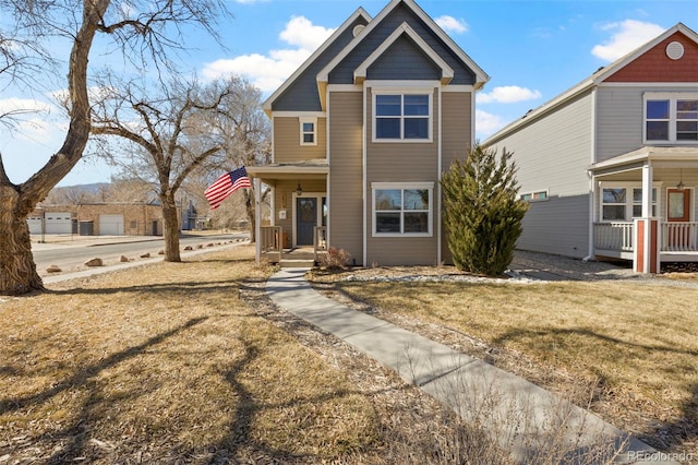 view of front of property with covered porch and a front lawn