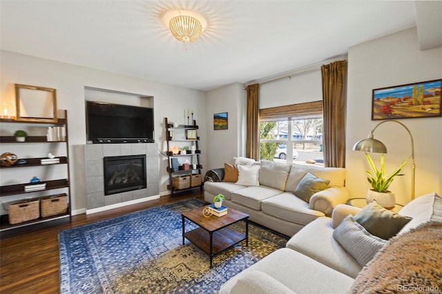 living area featuring a fireplace and wood finished floors