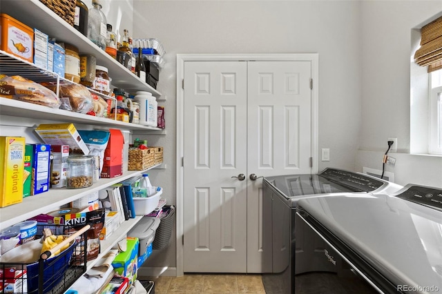 laundry room with light tile patterned floors, laundry area, and independent washer and dryer