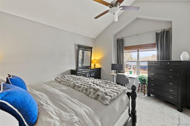 bedroom featuring vaulted ceiling, a ceiling fan, and light colored carpet