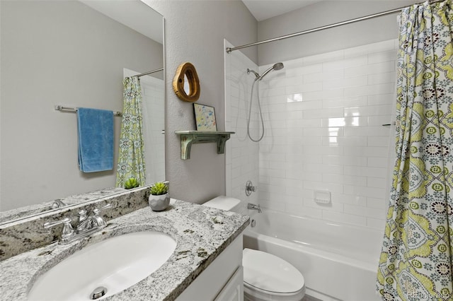 full bath with a textured wall, shower / bathtub combination with curtain, toilet, and vanity