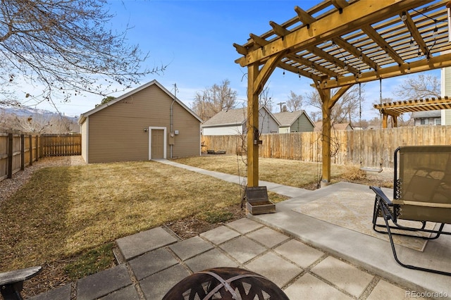 view of patio with a fenced backyard, an outdoor structure, and a pergola