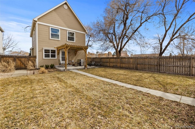 back of property with a patio area, a lawn, a fenced backyard, and a pergola