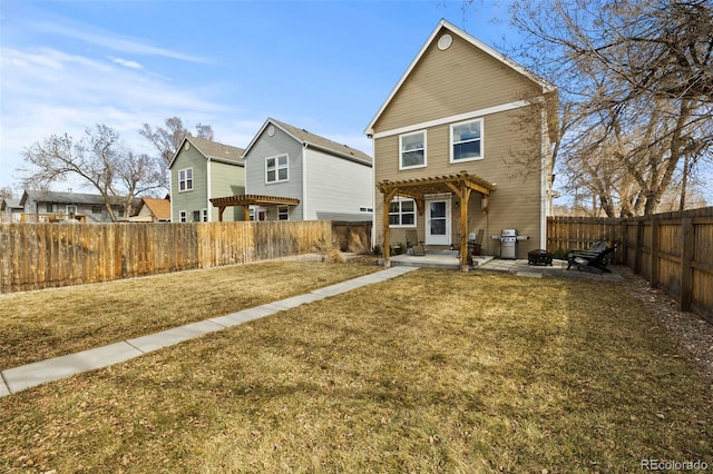 back of house with a yard, a patio area, a fenced backyard, and a pergola