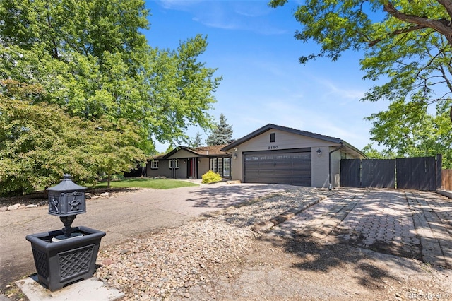 2180 Myrtlewood Ln, Lakewood, CO 80215 - view of front of property with driveway and an attached garage