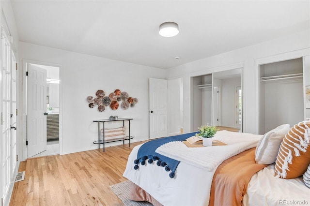 2180 Myrtlewood Ln, Lakewood, CO 80215 - bedroom with multiple closets, light wood-style floors, and ensuite bath