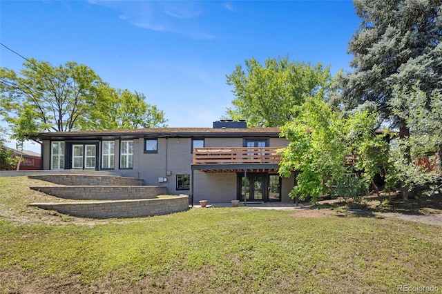 2180 Myrtlewood Ln, Lakewood, CO 80215 - back of property featuring a wooden deck and a lawn
