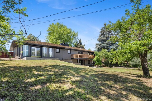 2180 Myrtlewood Ln, Lakewood, CO 80215 - back of house featuring a lawn