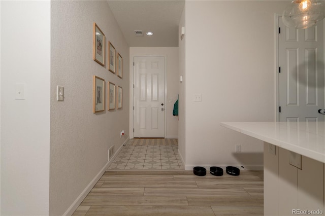 hallway featuring light wood-type flooring