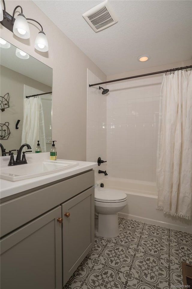 full bathroom featuring vanity, toilet, and shower / bathtub combination with curtain