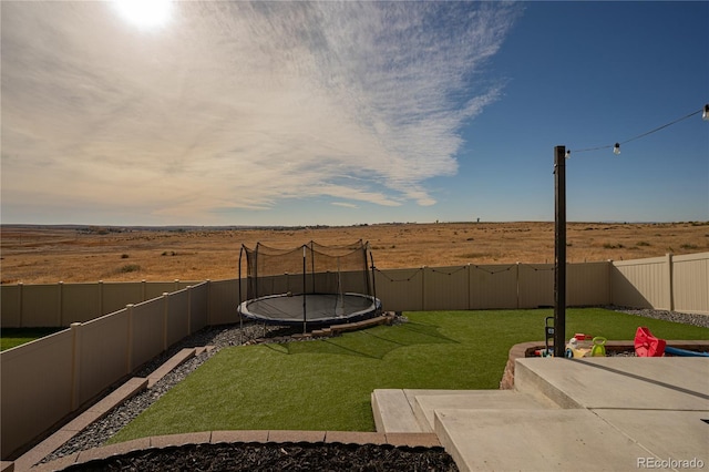 view of yard featuring a trampoline