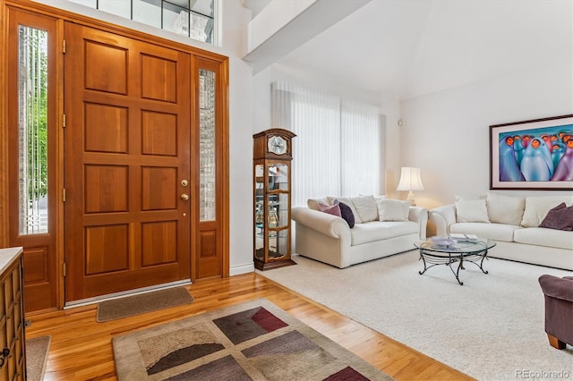 9411 E Hidden Hill Ln, Lone Tree, CO 80124 - entryway featuring light wood-style flooring and vaulted ceiling