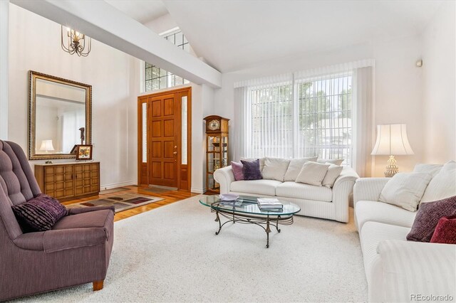 9411 E Hidden Hill Ln, Lone Tree, CO 80124 - living area featuring plenty of natural light, wood finished floors, and high vaulted ceiling