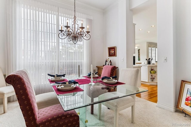 9411 E Hidden Hill Ln, Lone Tree, CO 80124 - dining room featuring carpet flooring, a chandelier, and ornamental molding