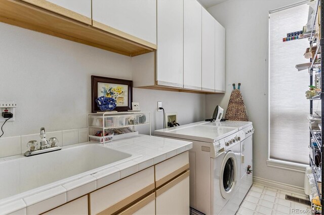 9411 E Hidden Hill Ln, Lone Tree, CO 80124 - laundry area featuring washing machine and clothes dryer and cabinet space