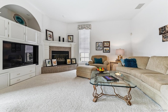 9411 E Hidden Hill Ln, Lone Tree, CO 80124 - carpeted living area featuring a tiled fireplace