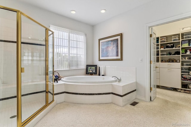 9411 E Hidden Hill Ln, Lone Tree, CO 80124 - full bathroom featuring a shower stall, a garden tub, and recessed lighting