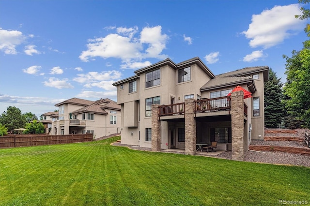 9411 E Hidden Hill Ln, Lone Tree, CO 80124 - back of property with a patio, stucco siding, and a deck