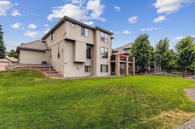 9411 E Hidden Hill Ln, Lone Tree, CO 80124 - rear view of house featuring stucco siding