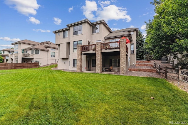 9411 E Hidden Hill Ln, Lone Tree, CO 80124 - back of house featuring stucco siding, a deck, and a patio area