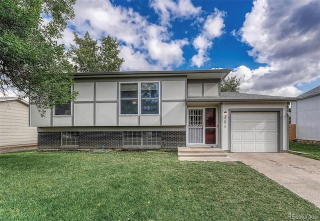 split level home with a garage, brick siding, driveway, stucco siding, and a front lawn