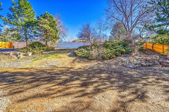 view of yard featuring a fenced backyard