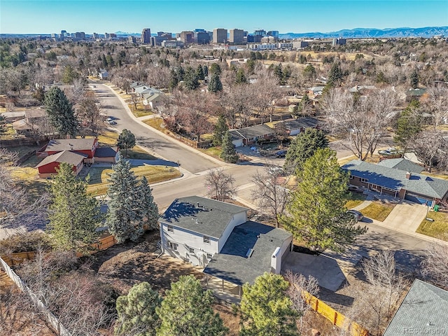 birds eye view of property featuring a view of city and a mountain view