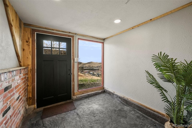 137 Hayden St, Cripple Creek, CO 80813 - foyer with baseboards, a textured wall, and a textured ceiling