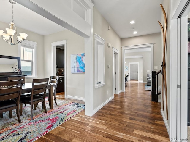 8012 E 50th Dr, Denver, CO 80238 - corridor featuring a chandelier, wood finished floors, and recessed lighting