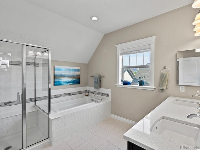 8012 E 50th Dr, Denver, CO 80238 - full bath with double vanity, a garden tub, a stall shower, lofted ceiling, and tile patterned floors