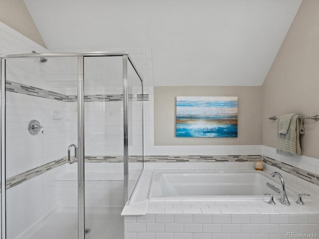 8012 E 50th Dr, Denver, CO 80238 - bathroom featuring vaulted ceiling, a bath, and a shower stall