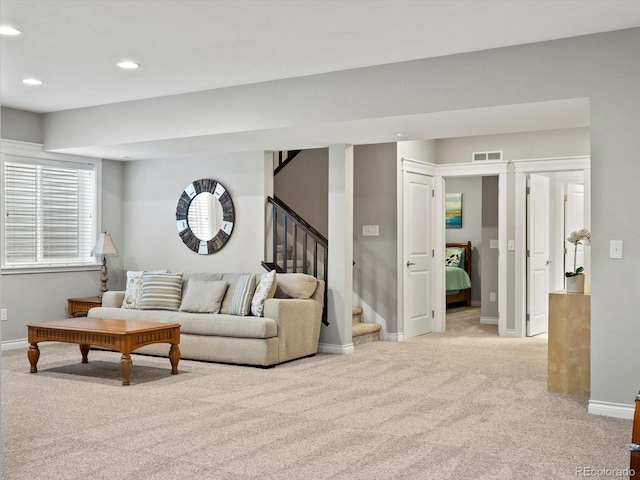8012 E 50th Dr, Denver, CO 80238 - living room with light colored carpet, stairs, and recessed lighting