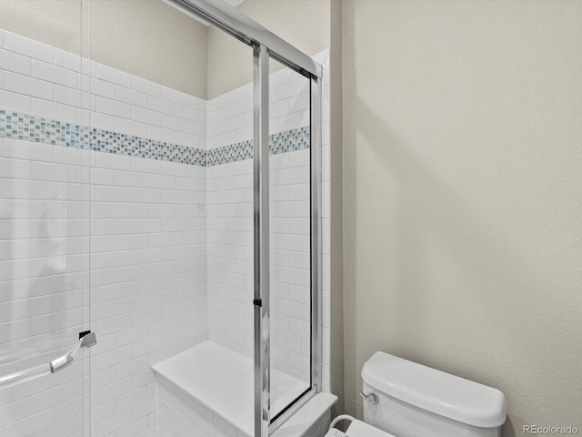 8012 E 50th Dr, Denver, CO 80238 - bathroom featuring a shower stall and a textured wall