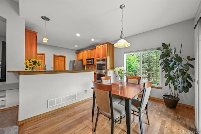 6475 Umber Cir, Arvada, CO 80007 - dining area featuring light wood-type flooring and recessed lighting