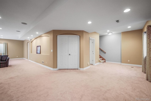 6475 Umber Cir, Arvada, CO 80007 - below grade area with light carpet, recessed lighting, and stairway