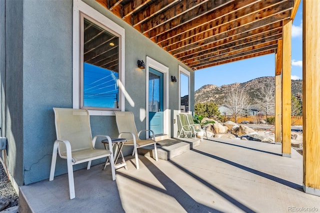 view of patio / terrace with a mountain view