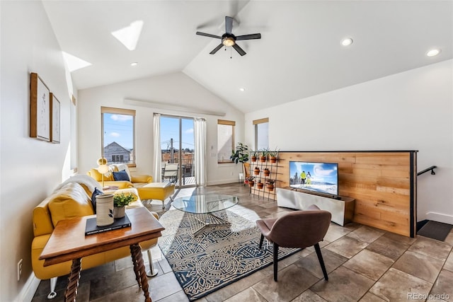 living room with ceiling fan and lofted ceiling