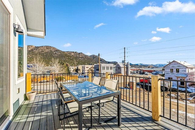 wooden deck with a mountain view