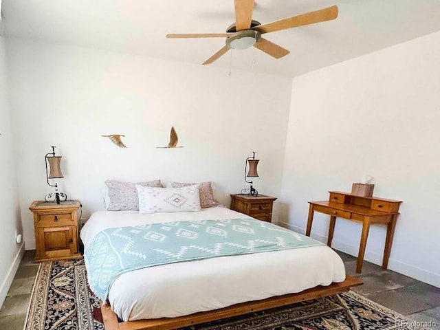 bedroom featuring ceiling fan and dark hardwood / wood-style flooring