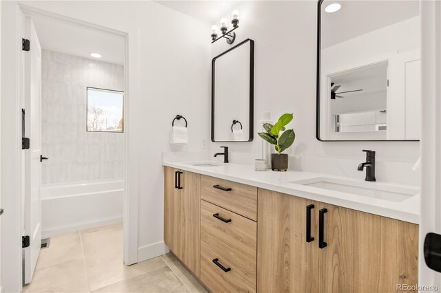 1344 N Knox Ct, Denver, CO 80204 - bathroom with double vanity, tile patterned floors, recessed lighting, and washtub / shower combination