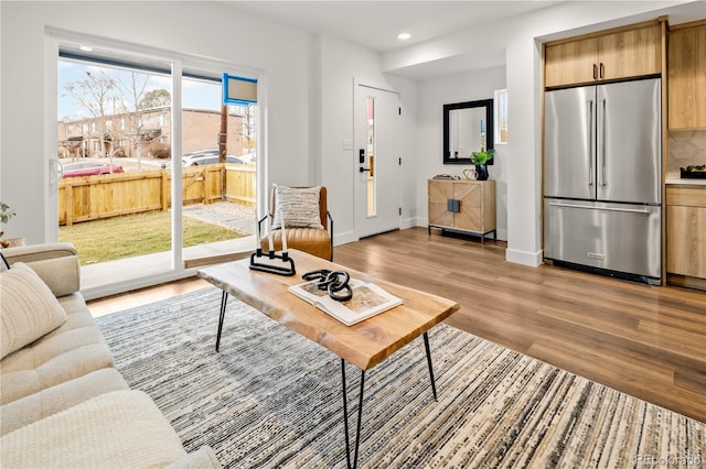 1344 N Knox Ct, Denver, CO 80204 - living area with light wood finished floors and recessed lighting