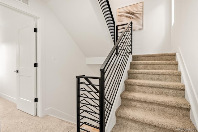 1344 N Knox Ct, Denver, CO 80204 - staircase with carpet flooring and baseboards