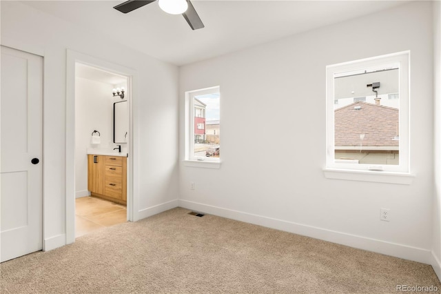 1344 N Knox Ct, Denver, CO 80204 - unfurnished bedroom with light carpet and ensuite bath
