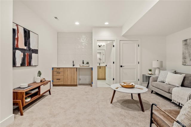 1344 N Knox Ct, Denver, CO 80204 - living area with light carpet, recessed lighting, and bar