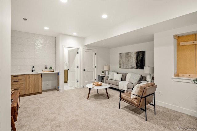 1344 N Knox Ct, Denver, CO 80204 - living room featuring wet bar, light carpet, and recessed lighting