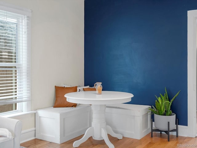 bathroom featuring wood-type flooring, a wealth of natural light, and breakfast area