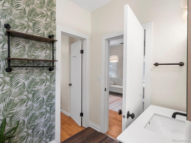 bathroom with vanity and hardwood / wood-style floors