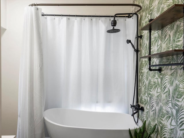 bathroom featuring separate shower and tub