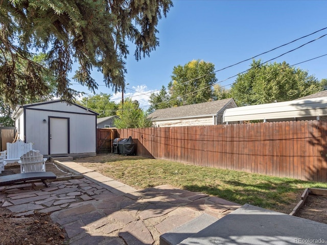 view of patio / terrace featuring a storage shed